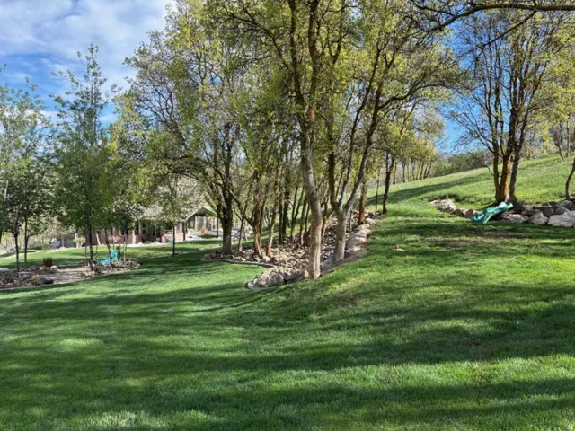 View of home's community featuring view of wooded area