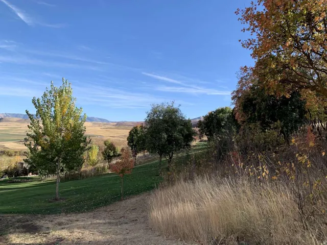 View of mountain background featuring rural landscape