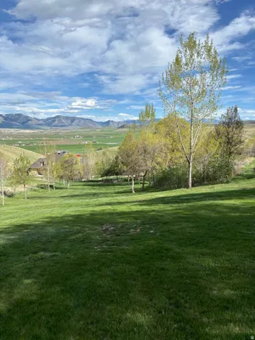View of property's community featuring a mountain view and a rural view