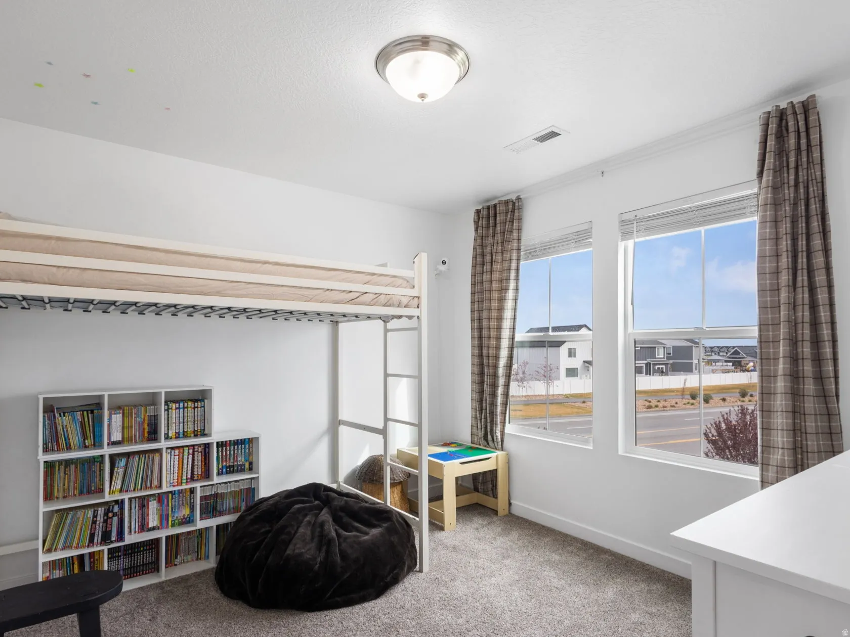 Bedroom 3 featuring large windows with a view and natural light