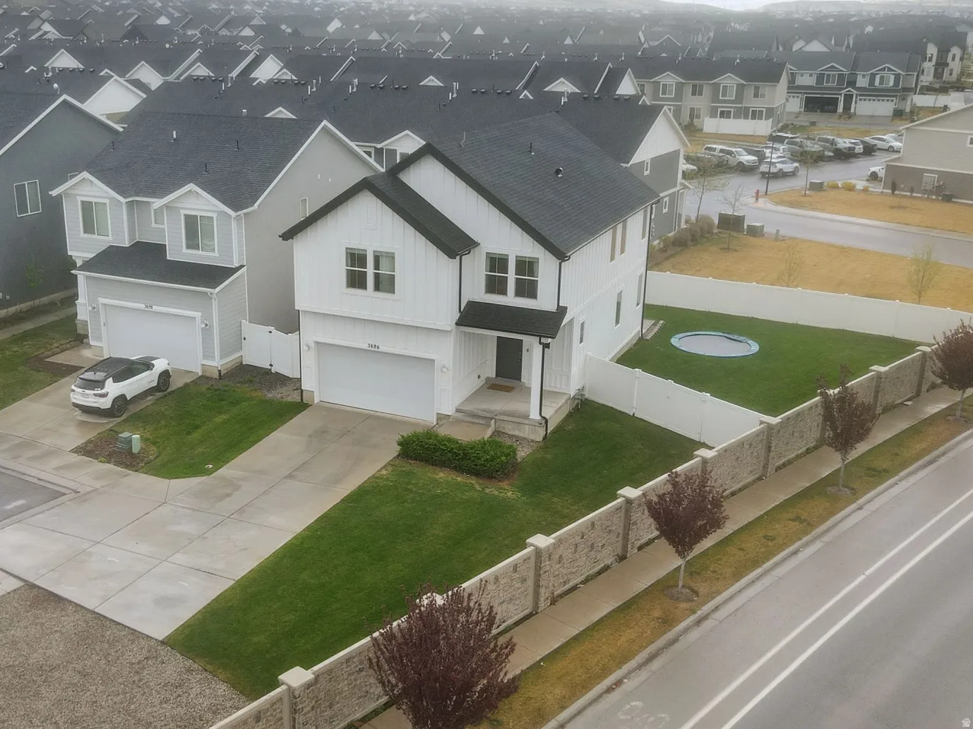 Aerial view showing large, fully fenced yard