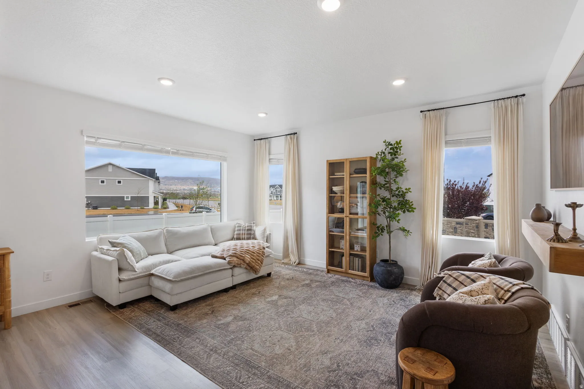 Living room featuring large windows and   natural light