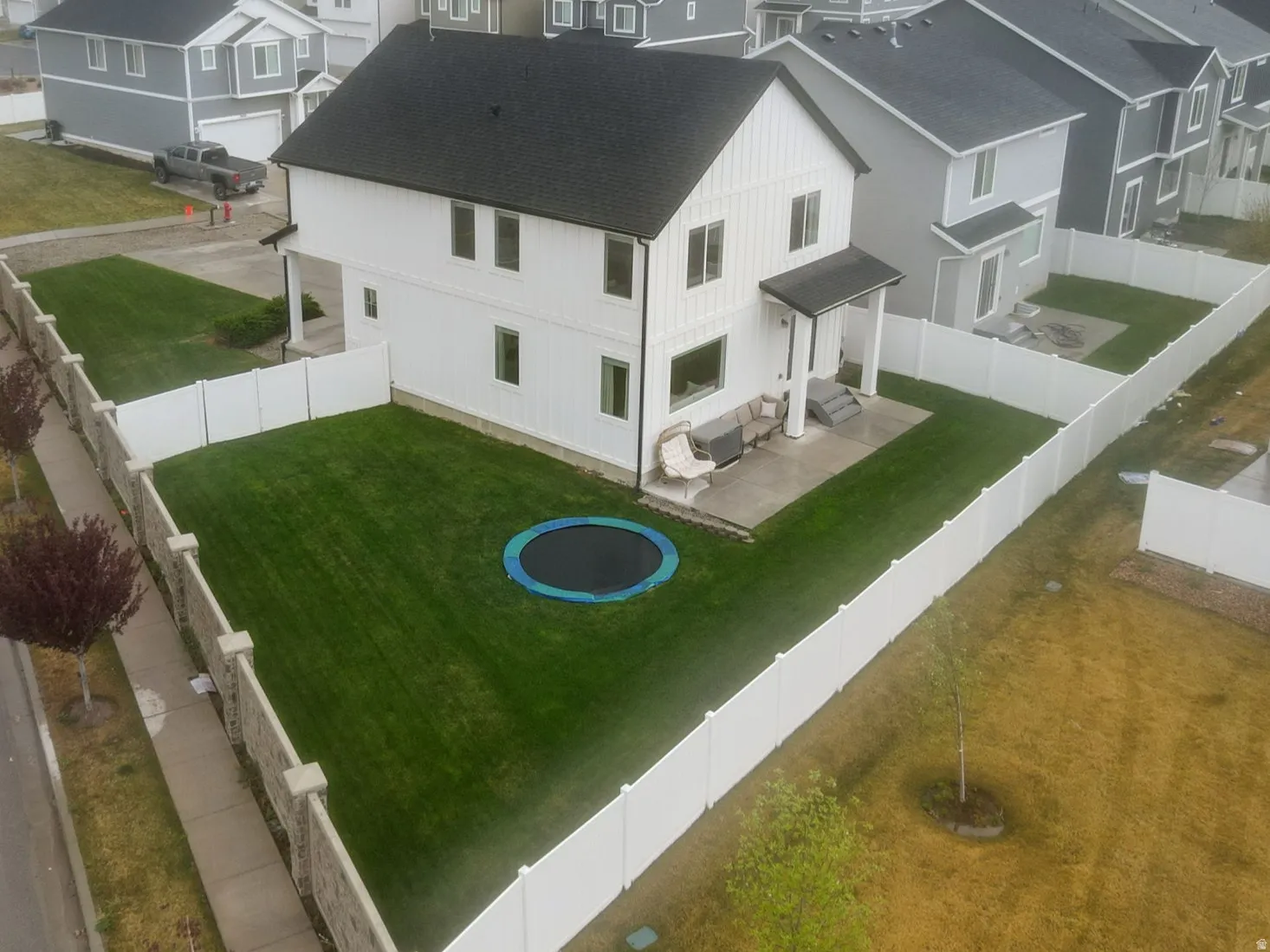 Aerial perspective of large fully fenced yard