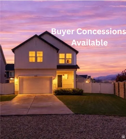 Two-story residence featuring a two-car garage, concrete driveway, and covered front entry