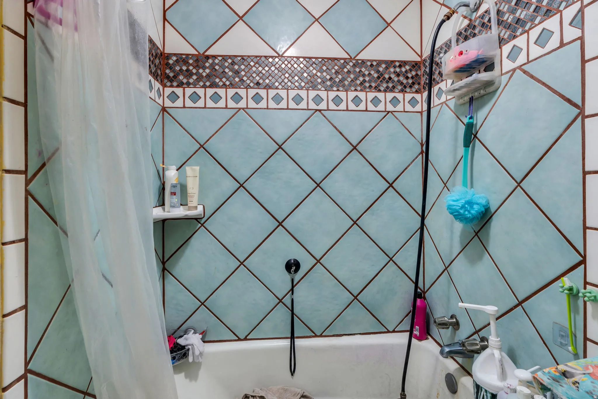 Full bath featuring shower / tub combo