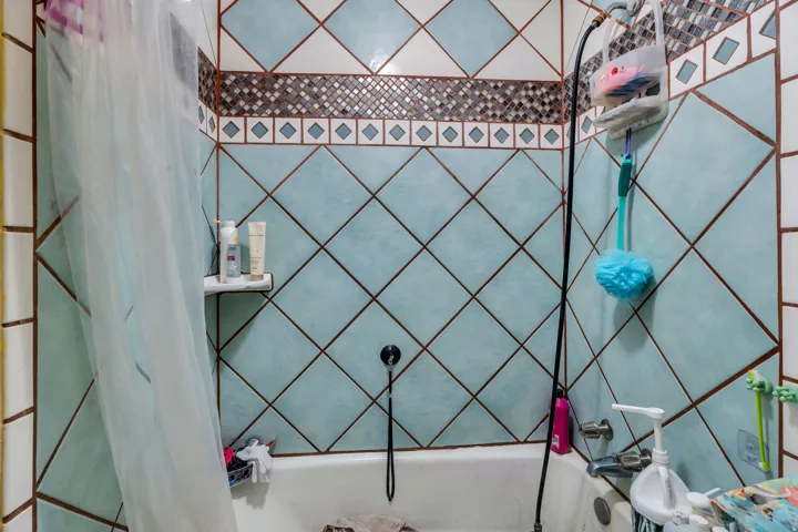 Full bath featuring shower / tub combo