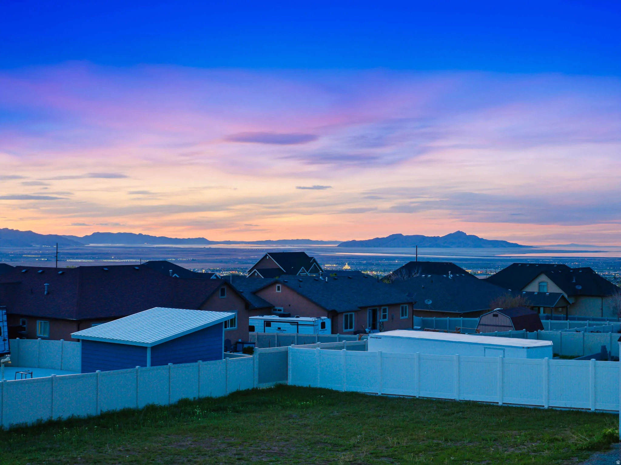 View of mountain background featuring nearby suburban area