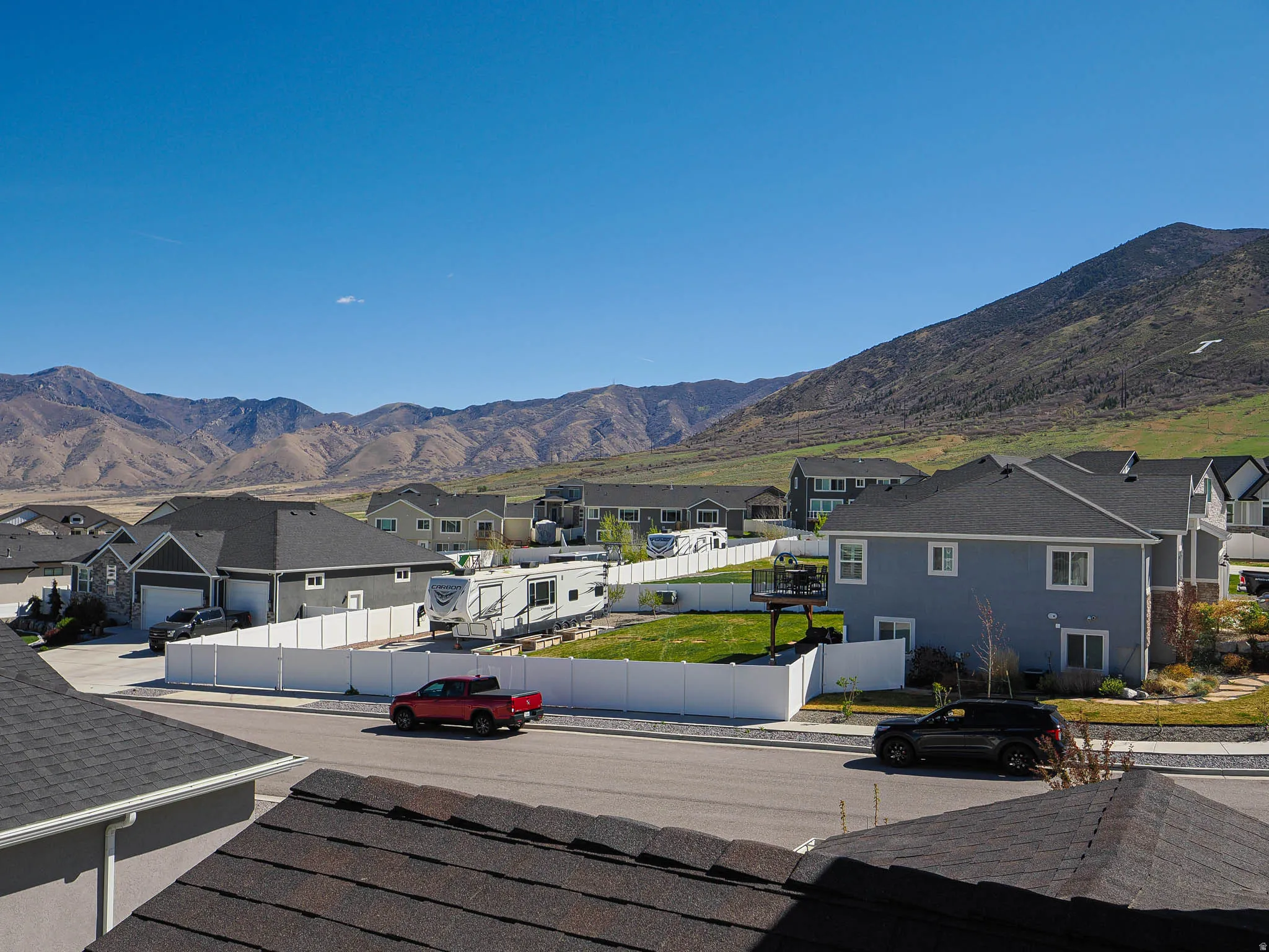 View of mountain backdrop featuring nearby suburban area