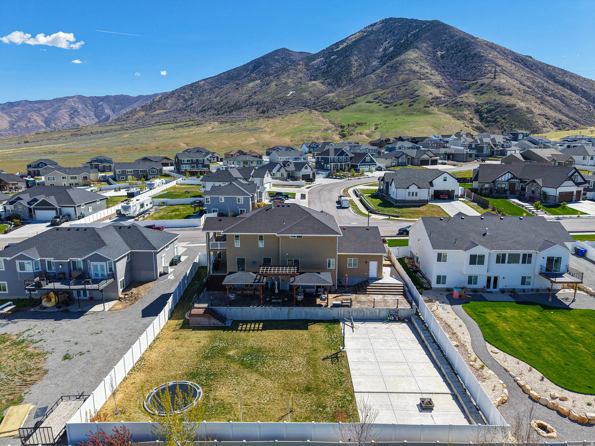 Aerial perspective of suburban area with a mountain backdrop