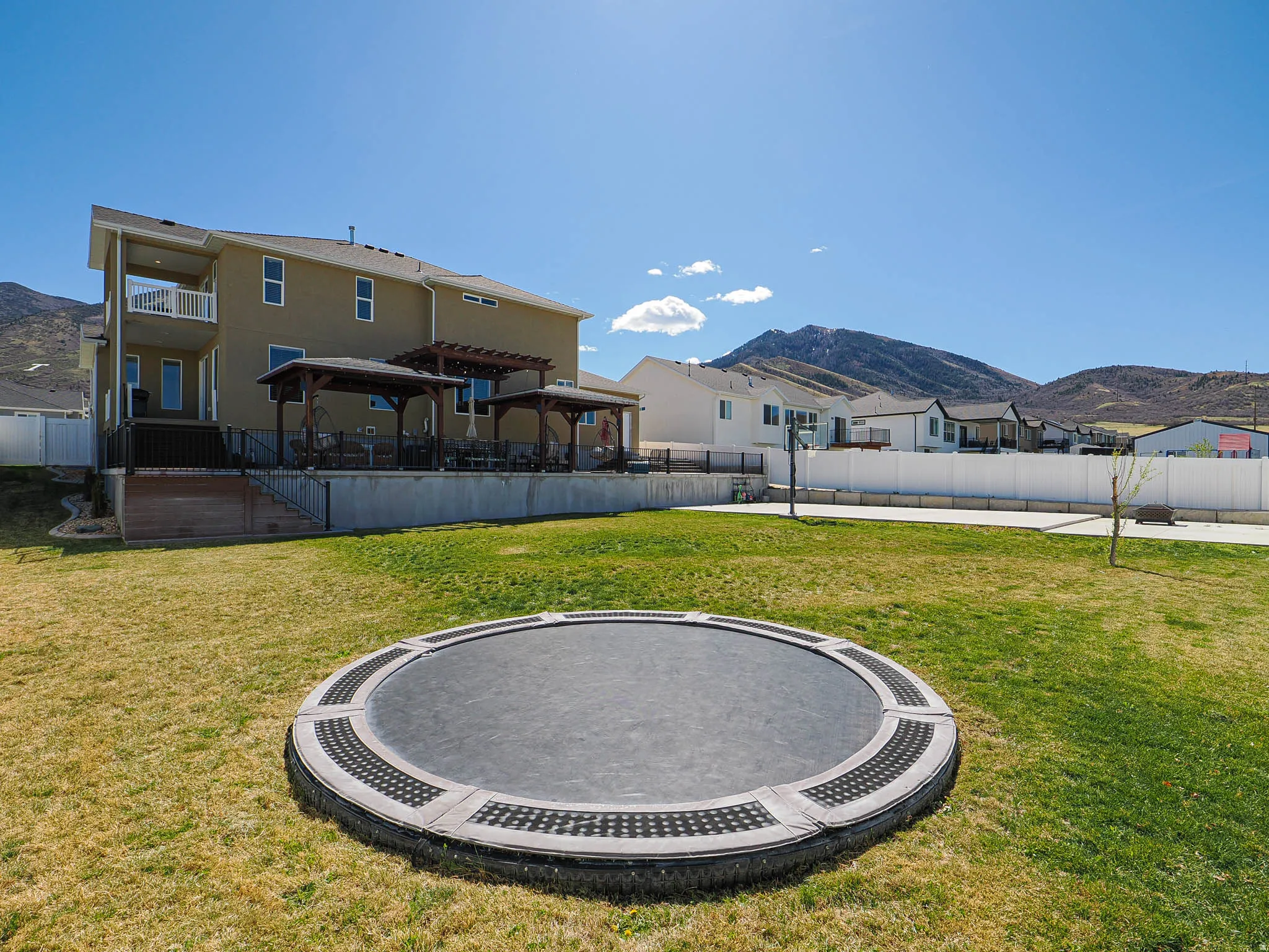 View of yard featuring a mountain view, a gazebo, a residential view, and a patio area