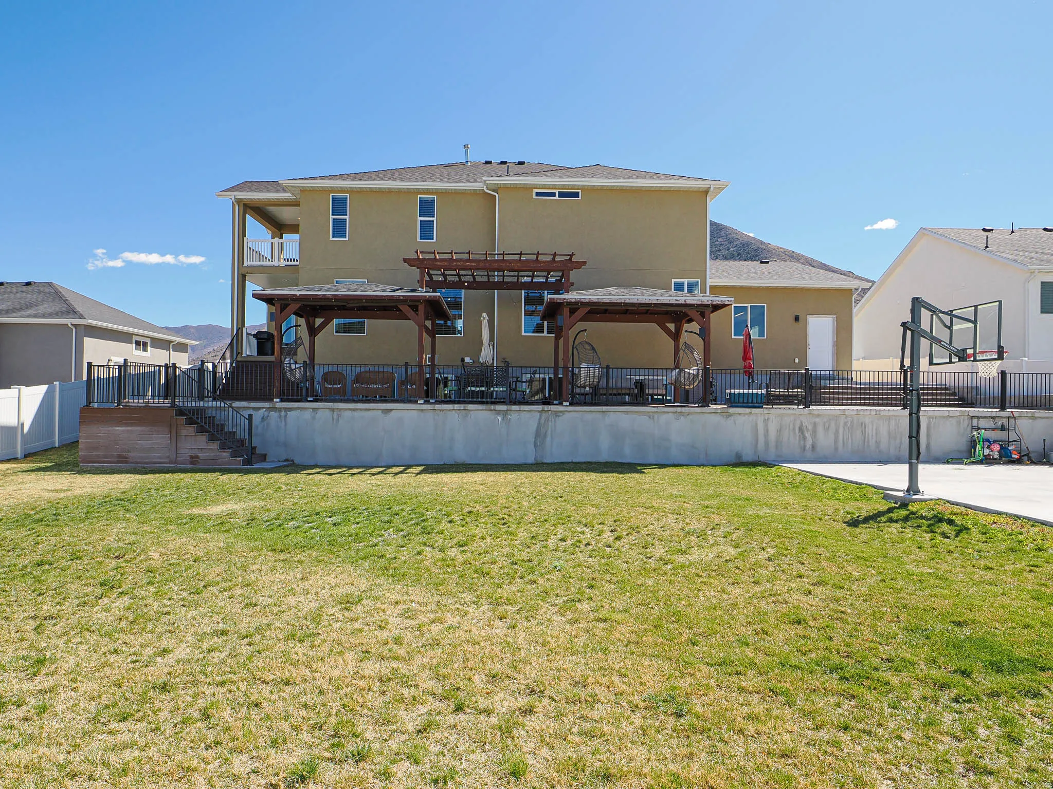 Rear view of property with stucco siding and a patio area