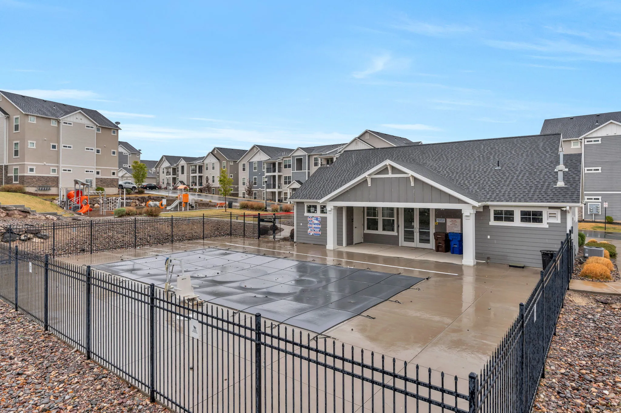 Community pool with a residential view