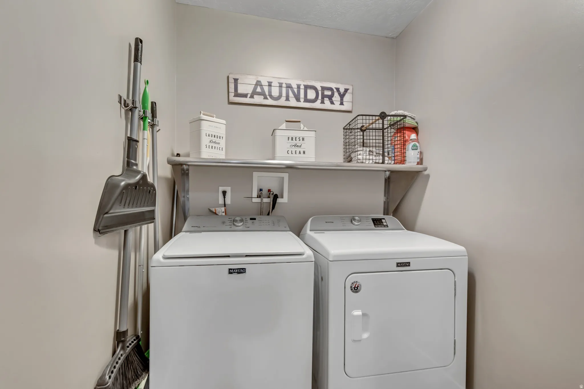 Laundry area featuring separate washer and dryer