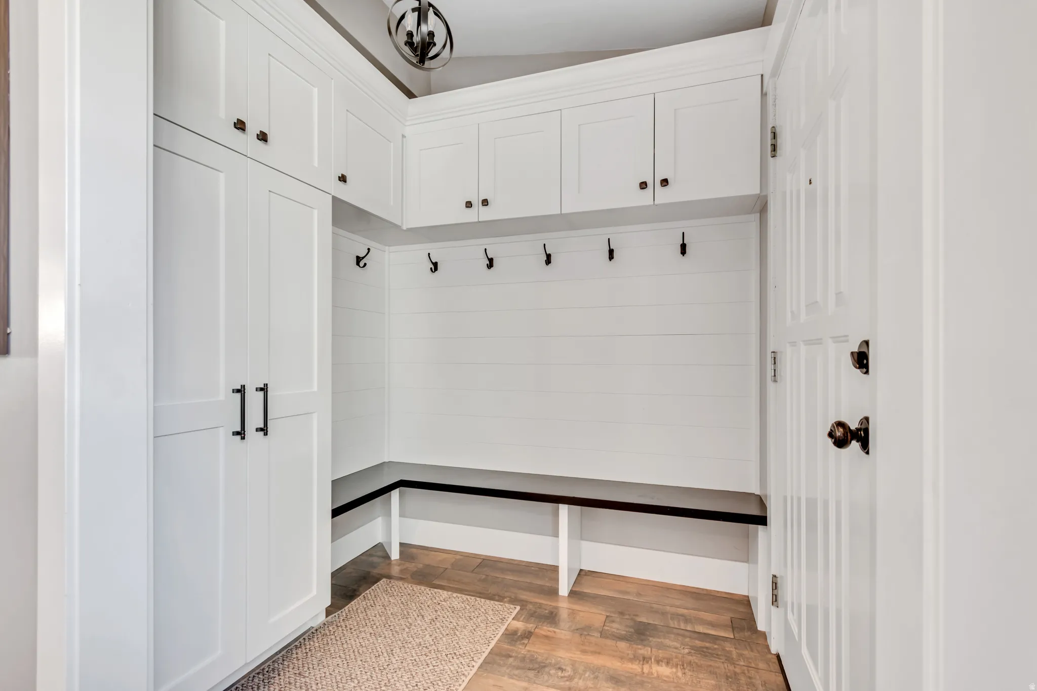 Mudroom with light wood-style flooring