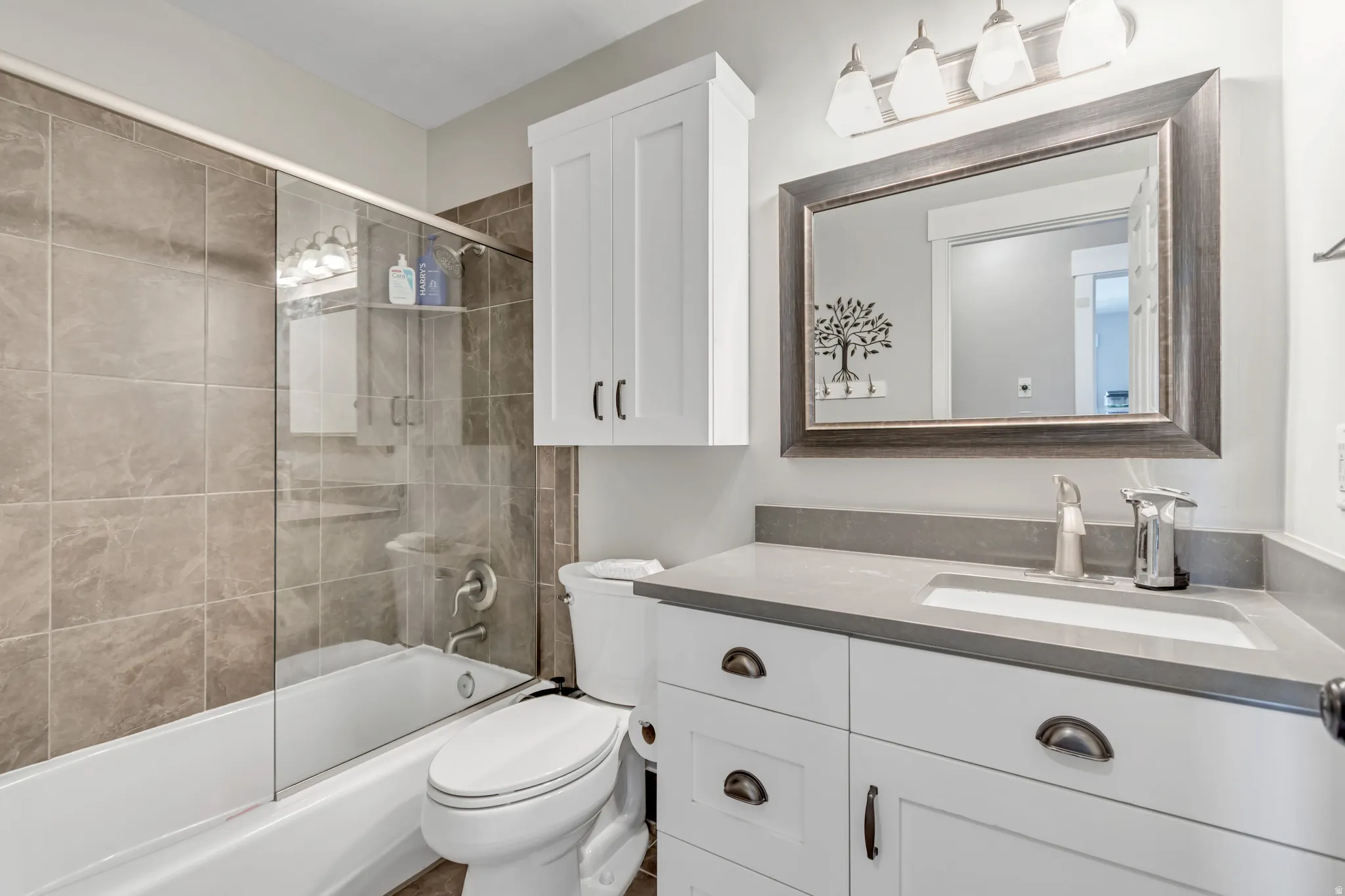 Full bathroom with vanity and shower / bath combination with glass door