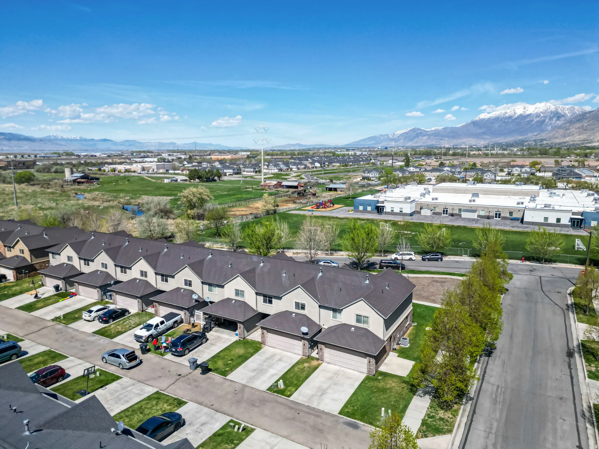 Aerial perspective of suburban area with a mountainous background