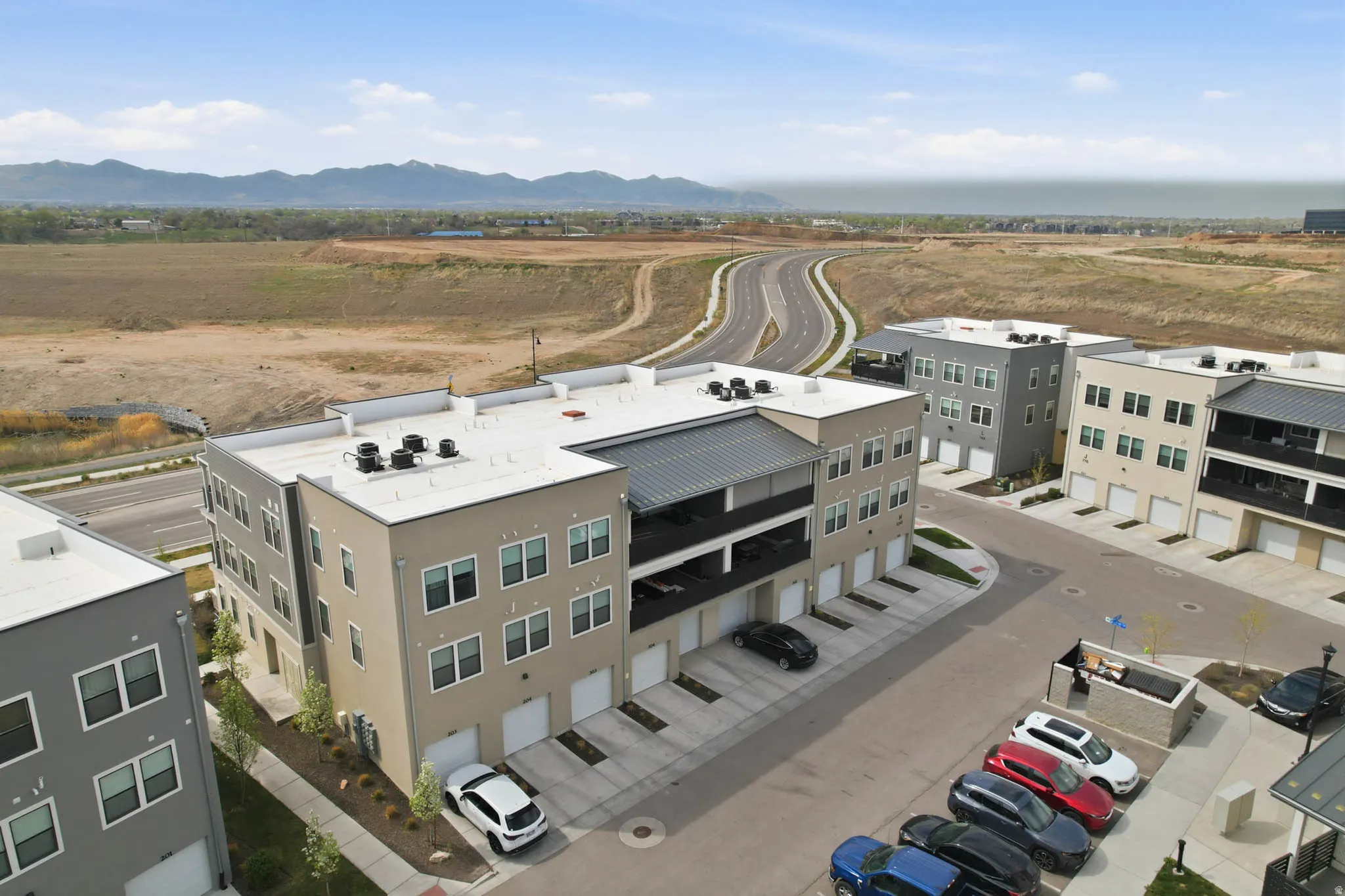 Bird's eye view of a mountain backdrop and apartment complex