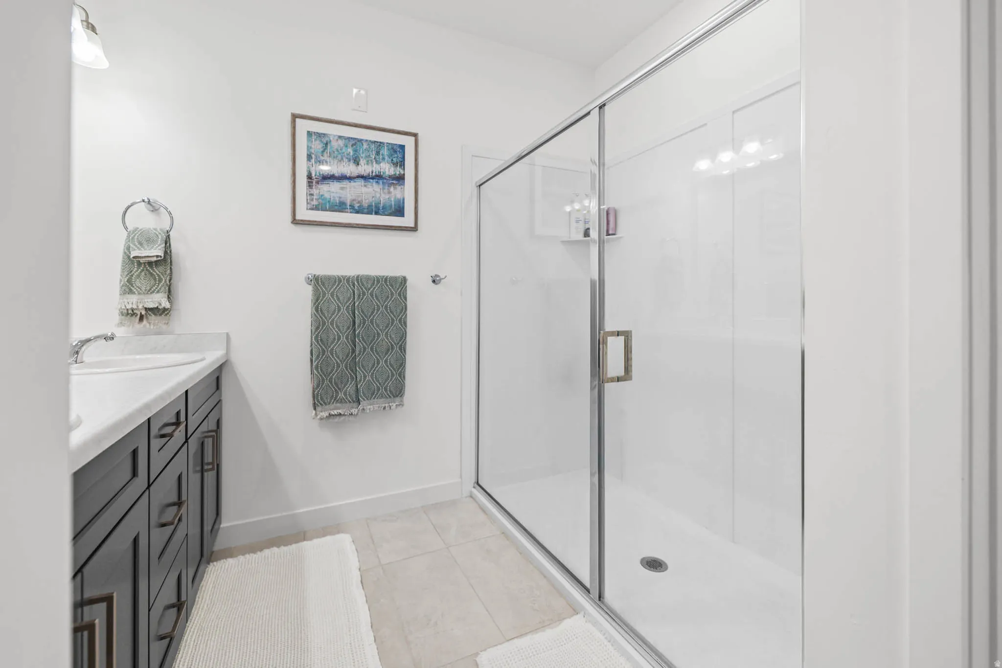 Primary bathroom featuring walk in shower