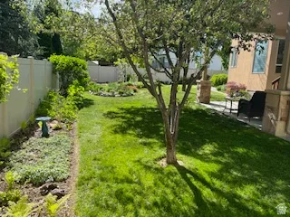 Fenced backyard with a patio