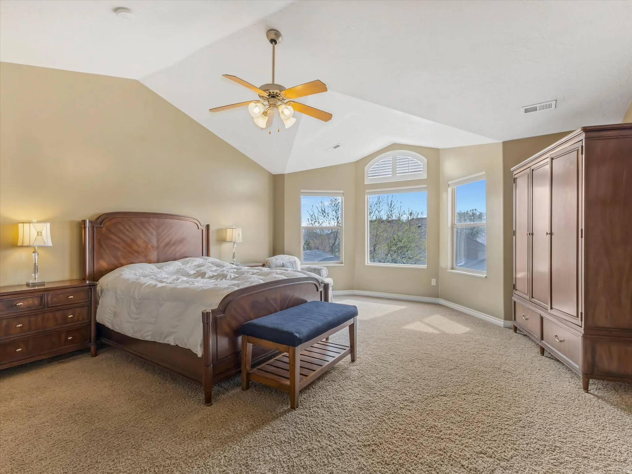 Bedroom with light carpet and ceiling fan