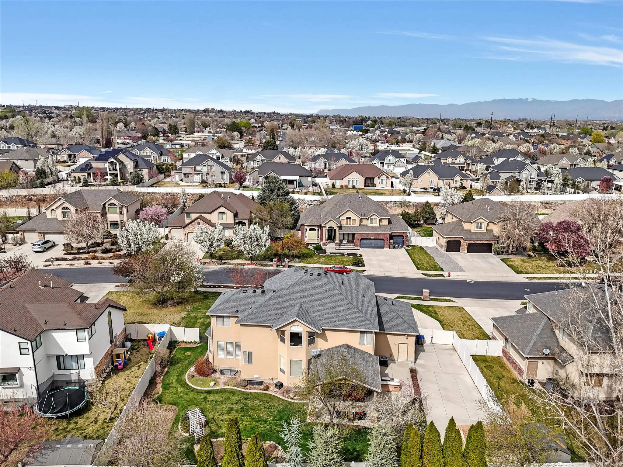Aerial view of residential area featuring a mountain backdrop