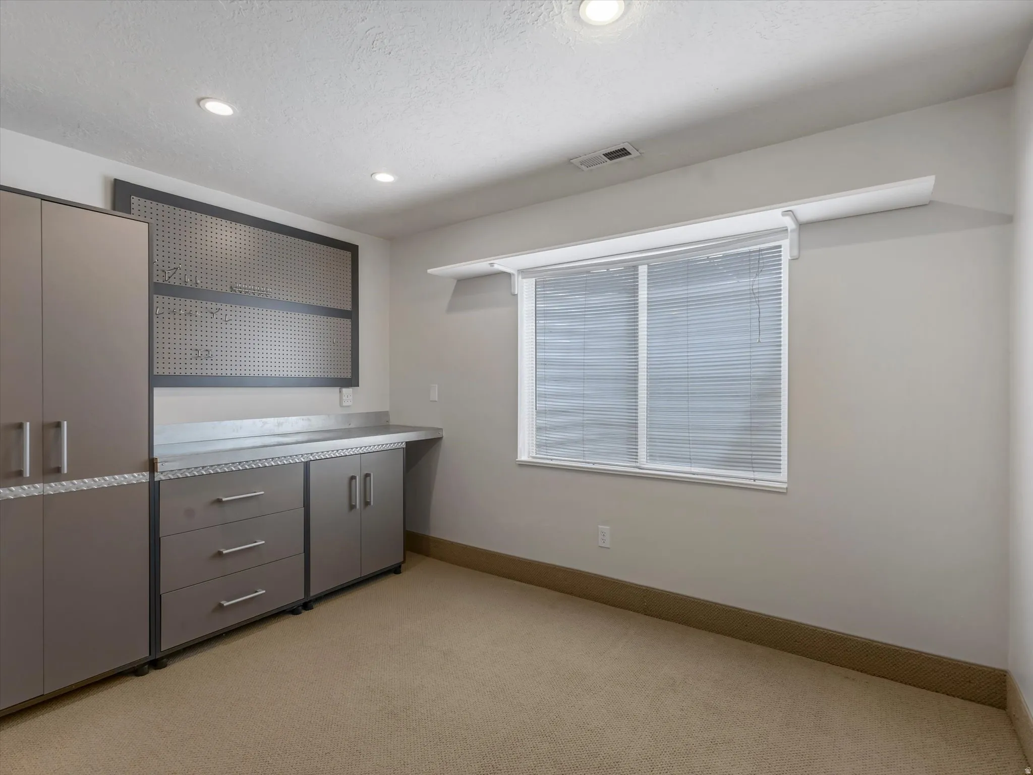 Bar area with gray cabinetry, light countertops, light carpet, open shelves, and recessed lighting