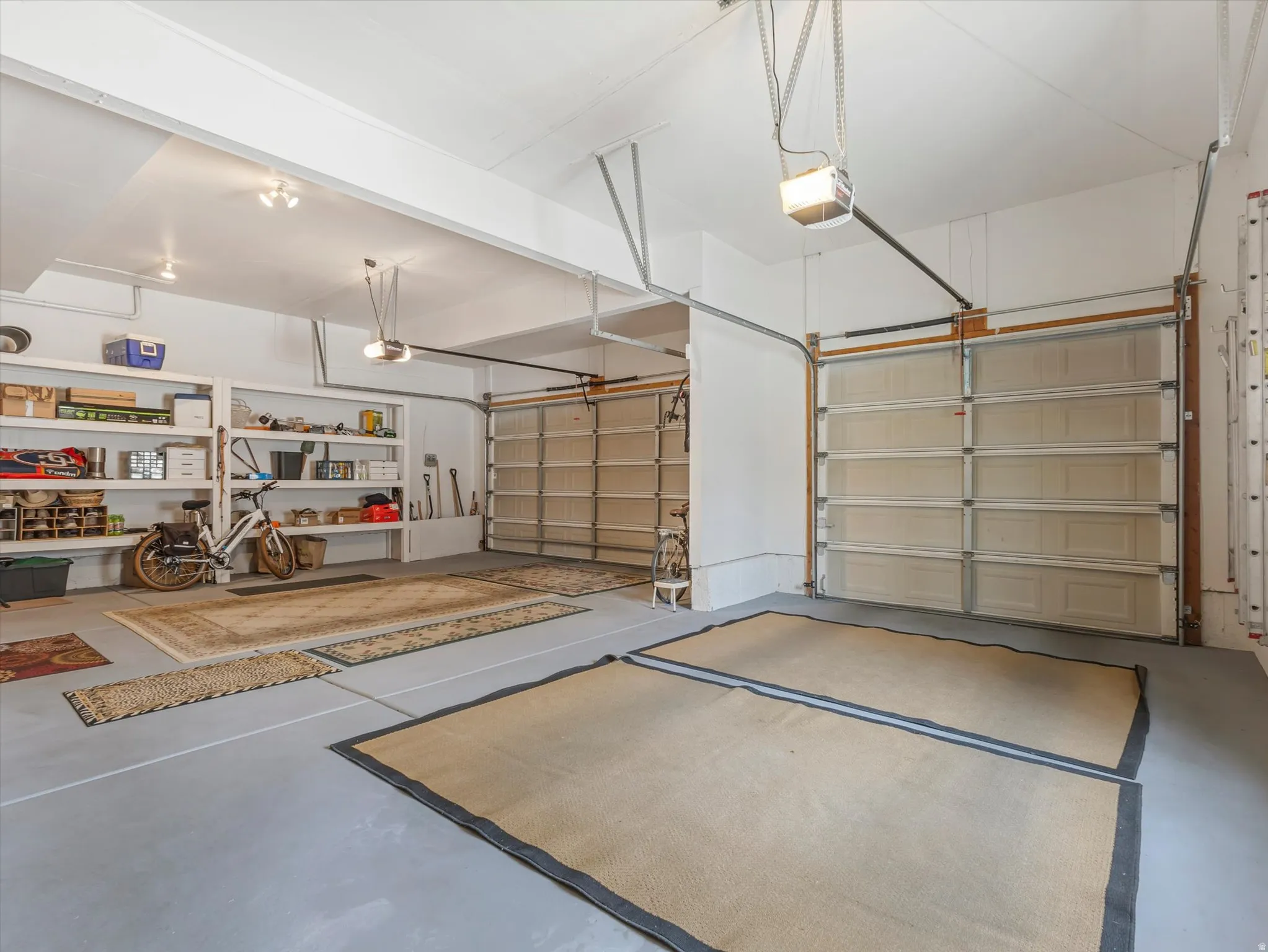 Garage featuring a garage door opener