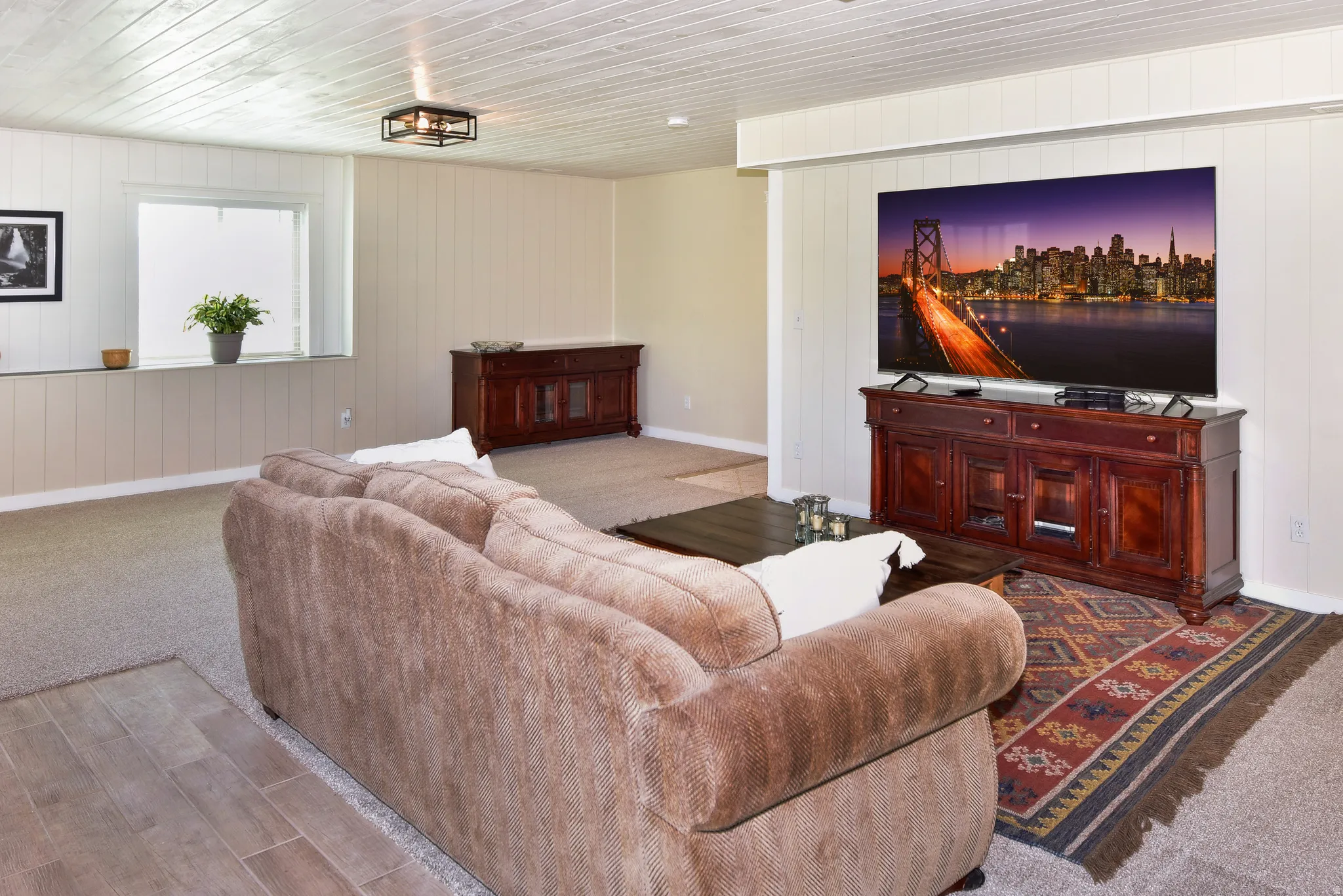 Living area featuring wood walls and wood finished floors