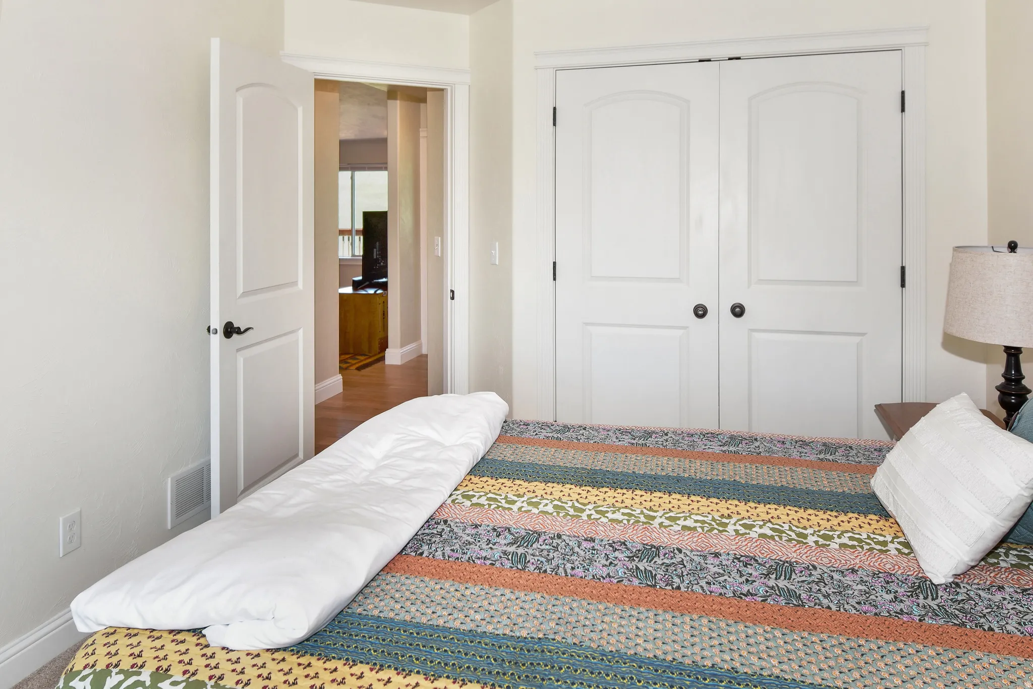 Bedroom featuring baseboards and a closet