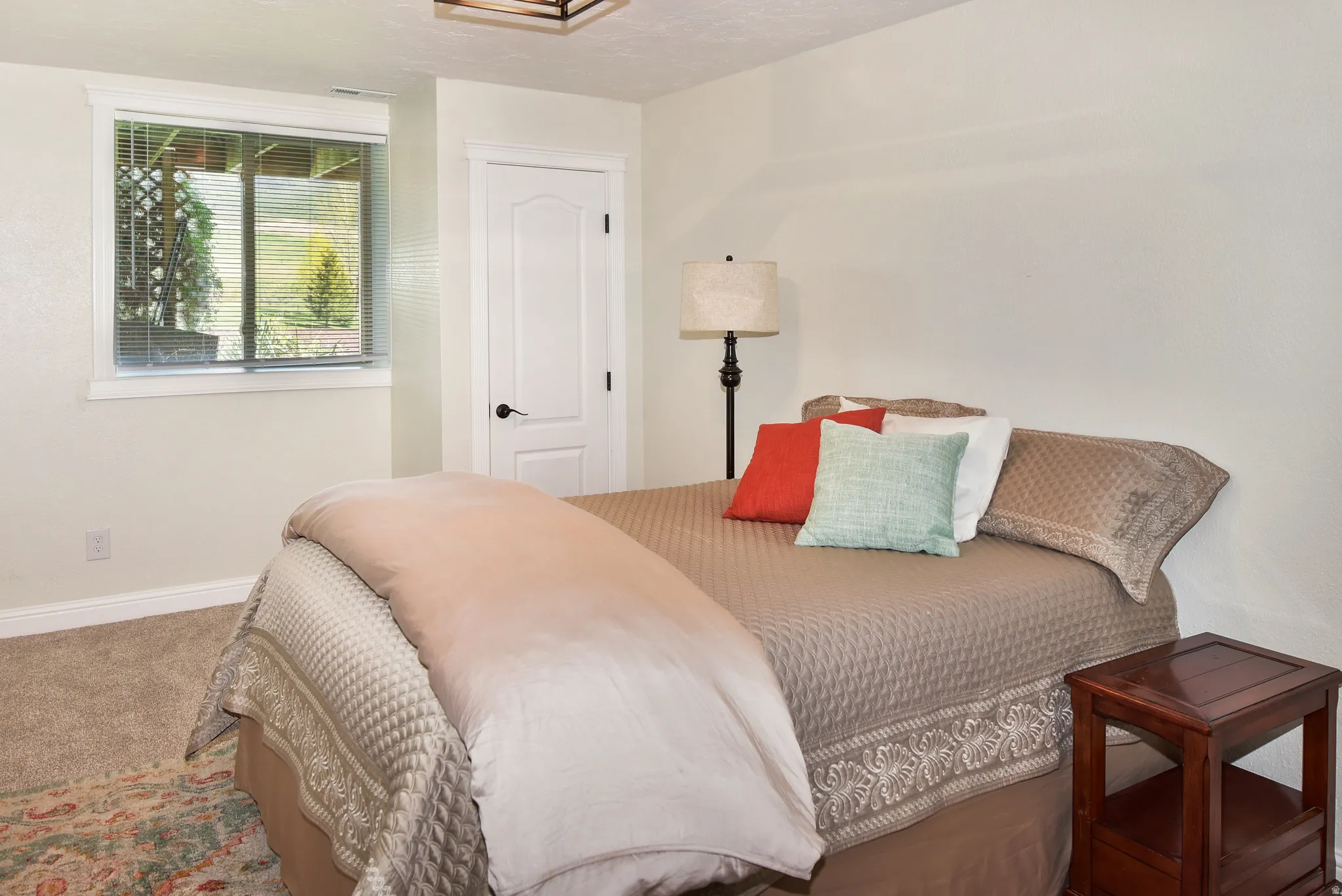 Carpeted bedroom featuring baseboards
