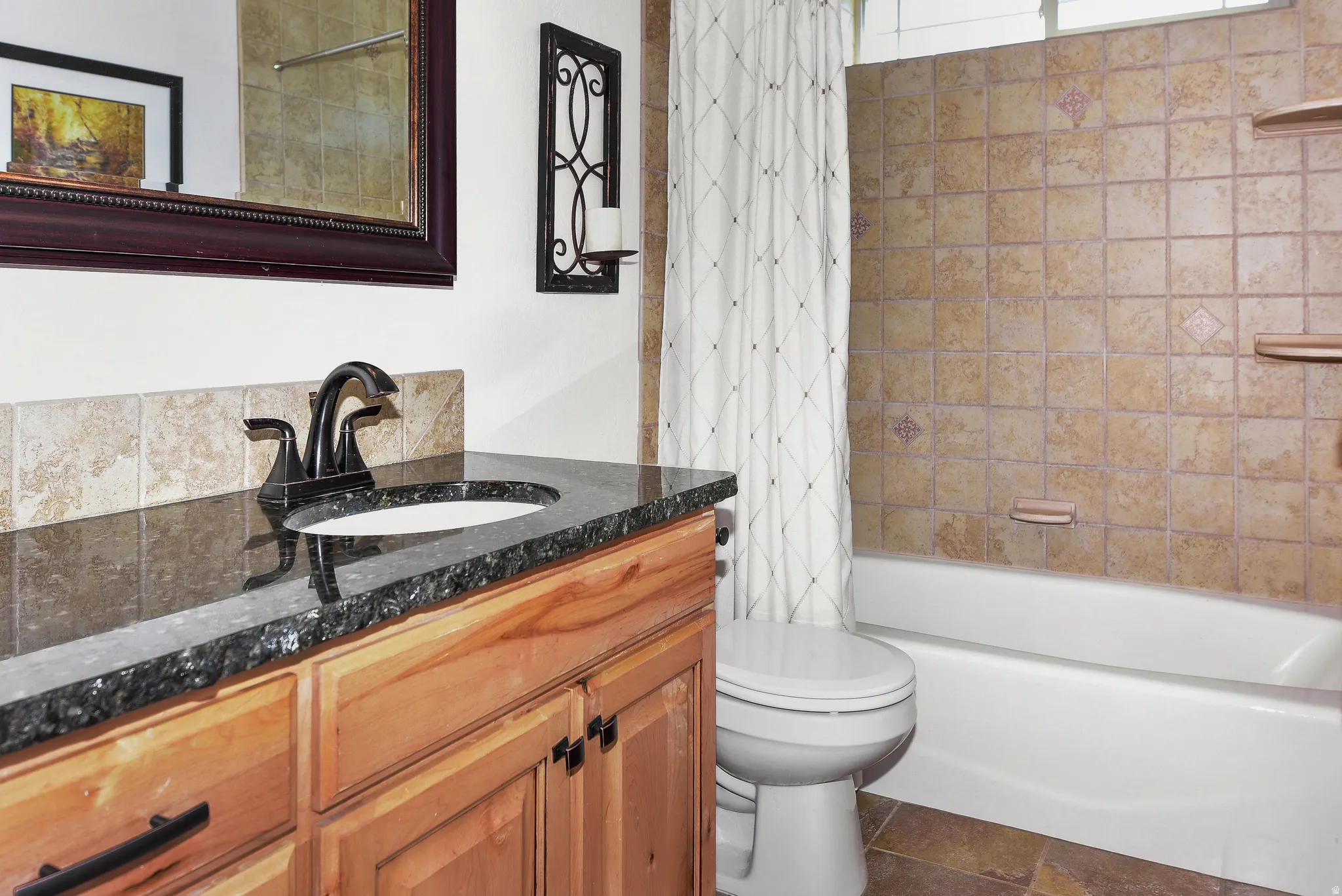Full bath with shower / bathtub combination with curtain and vanity