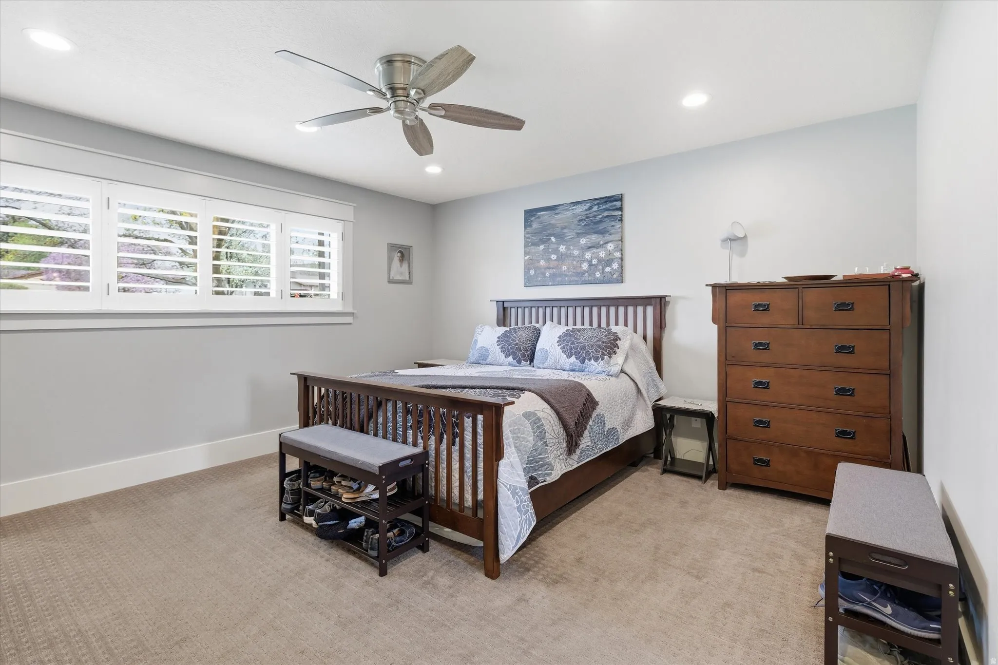 Bedroom featuring ceiling fan, light carpet, and recessed lighting