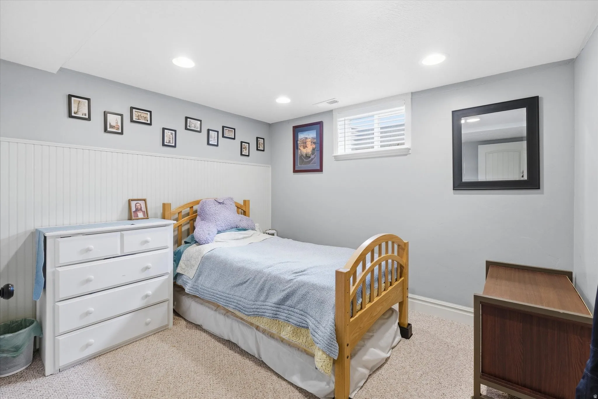 Bedroom with carpet flooring, wainscoting, and recessed lighting