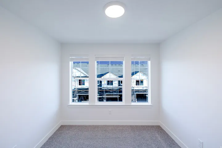 Three single-hung windows with white blinds