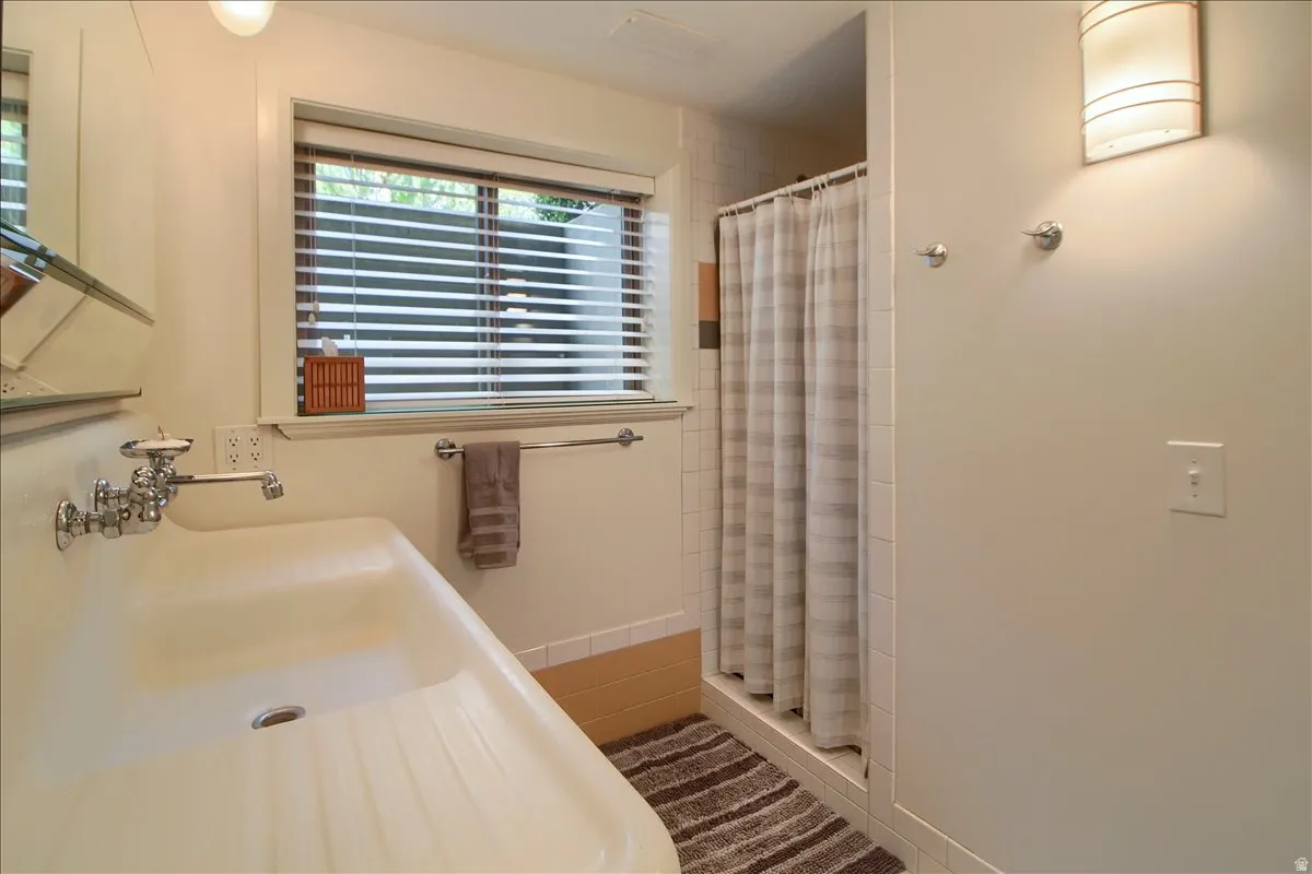 Full bathroom featuring a stall shower and vanity