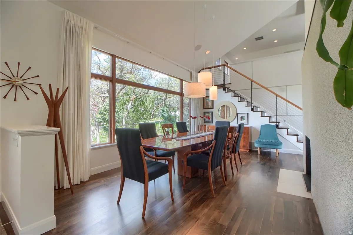 Dining room featuring dark wood-style floors and recessed lighting