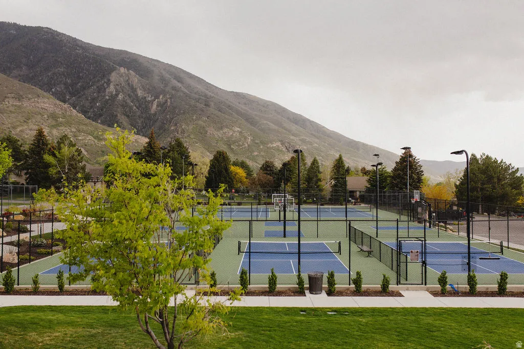 View of tennis court featuring a mountain view