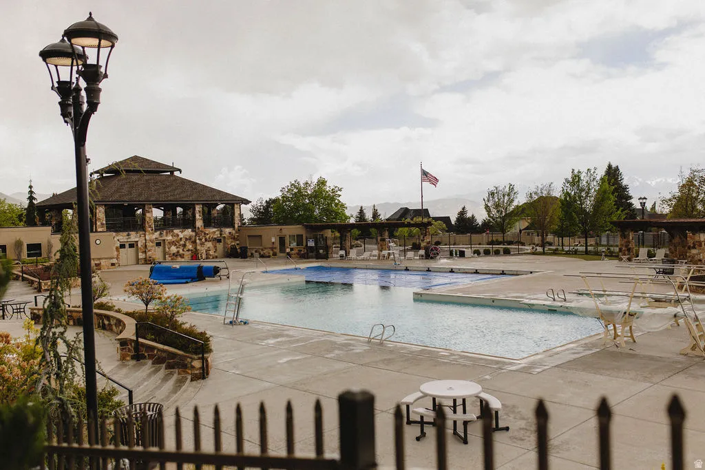 Community pool featuring a patio area