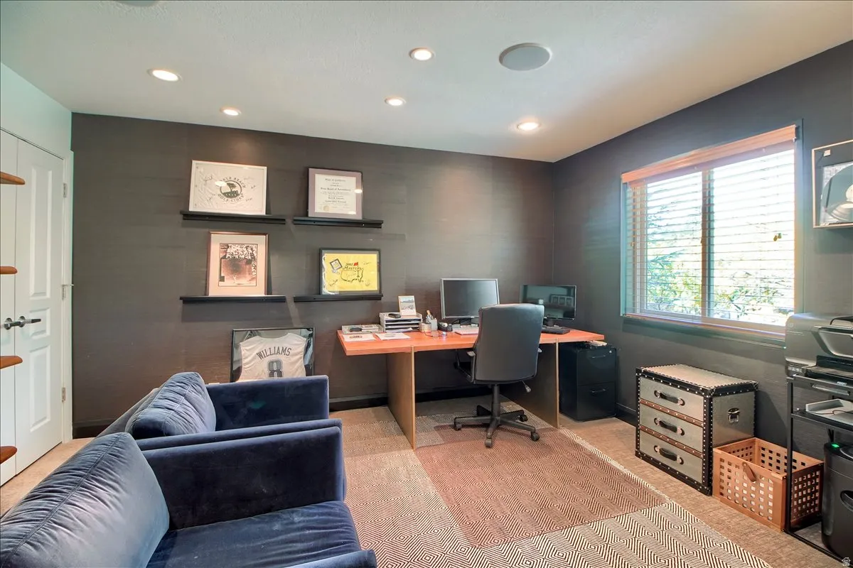 Office area featuring recessed lighting