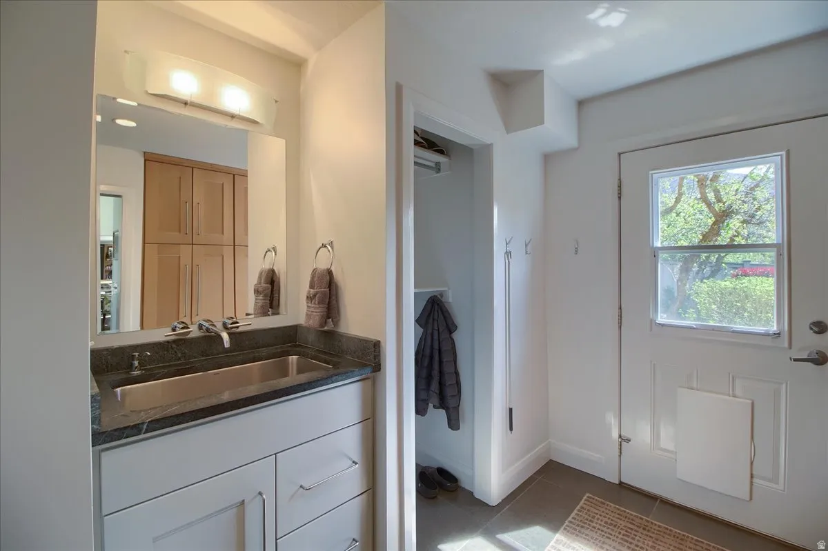 Bathroom featuring vanity and light tile patterned floors