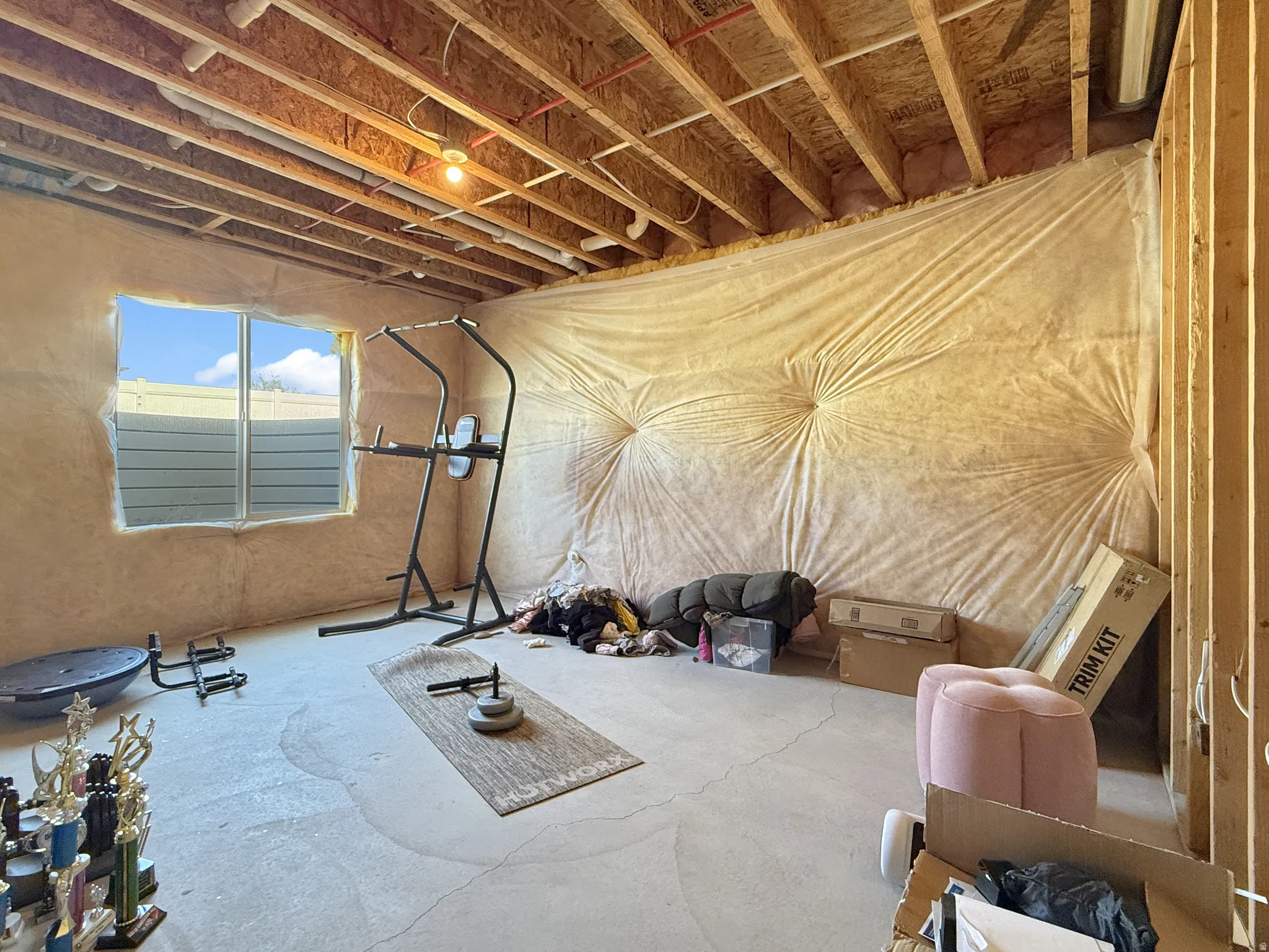 Workout area featuring concrete flooring
