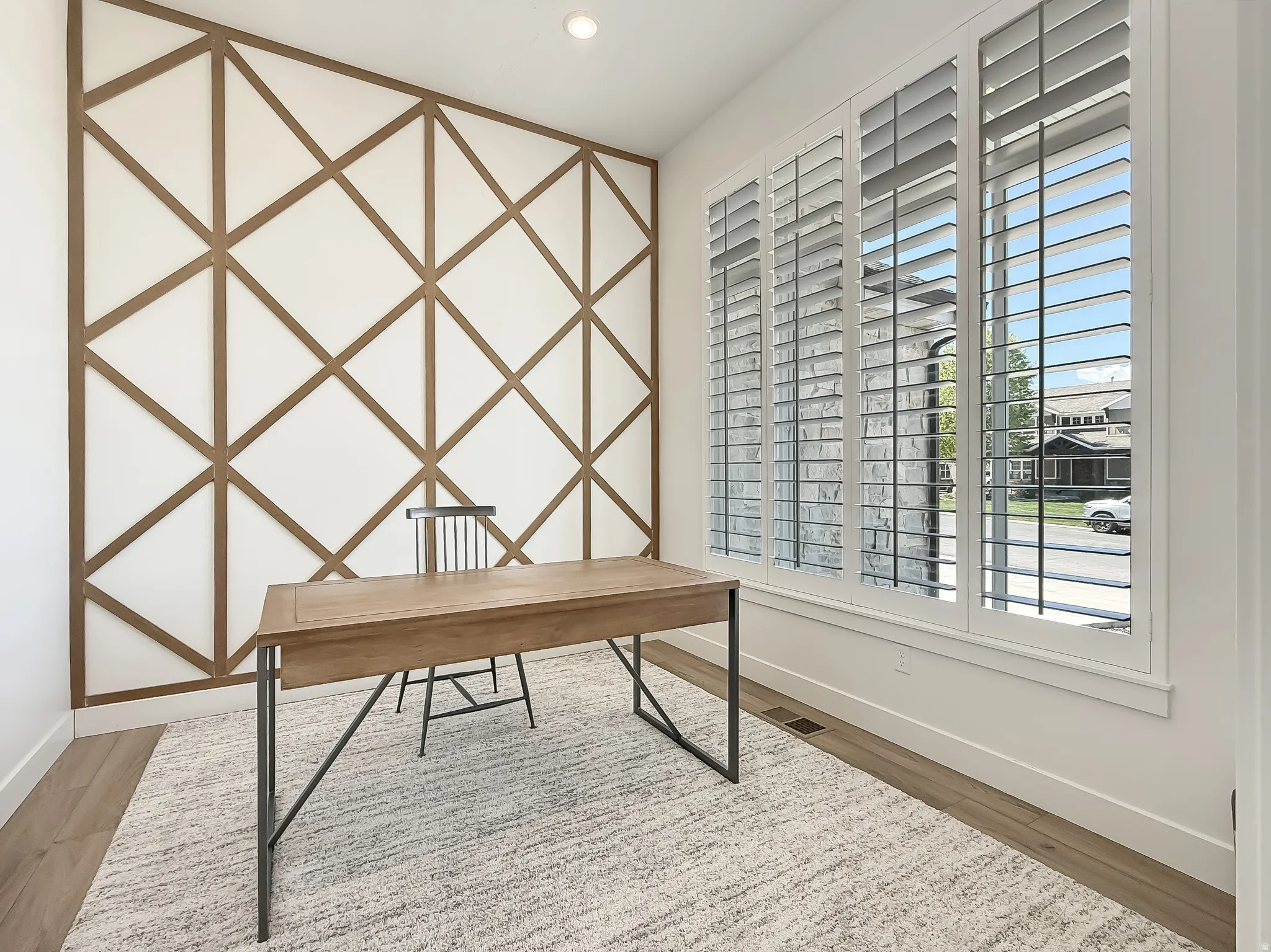 Unfurnished office with light wood finished floors and recessed lighting