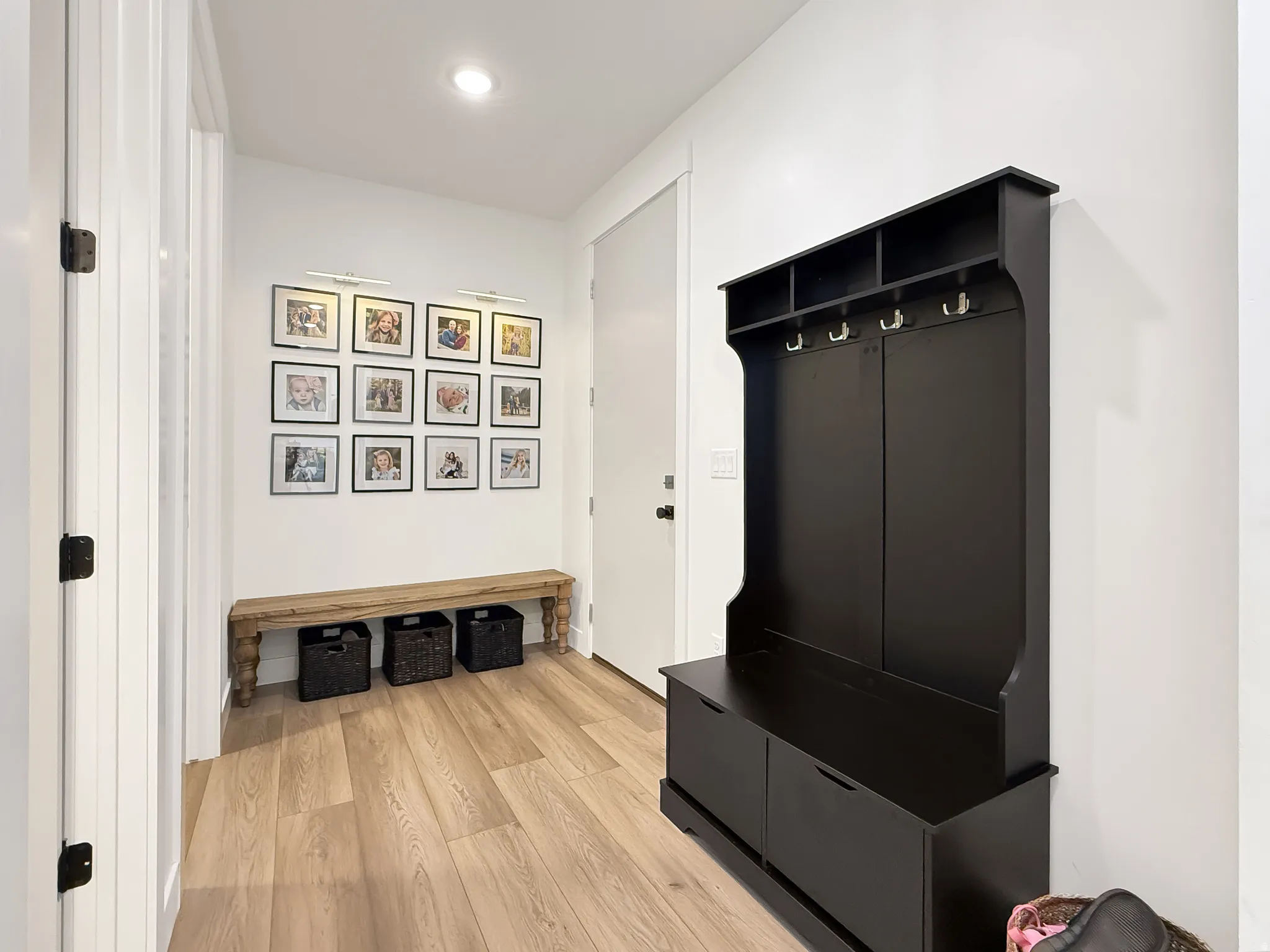 Mudroom with light wood finished floors