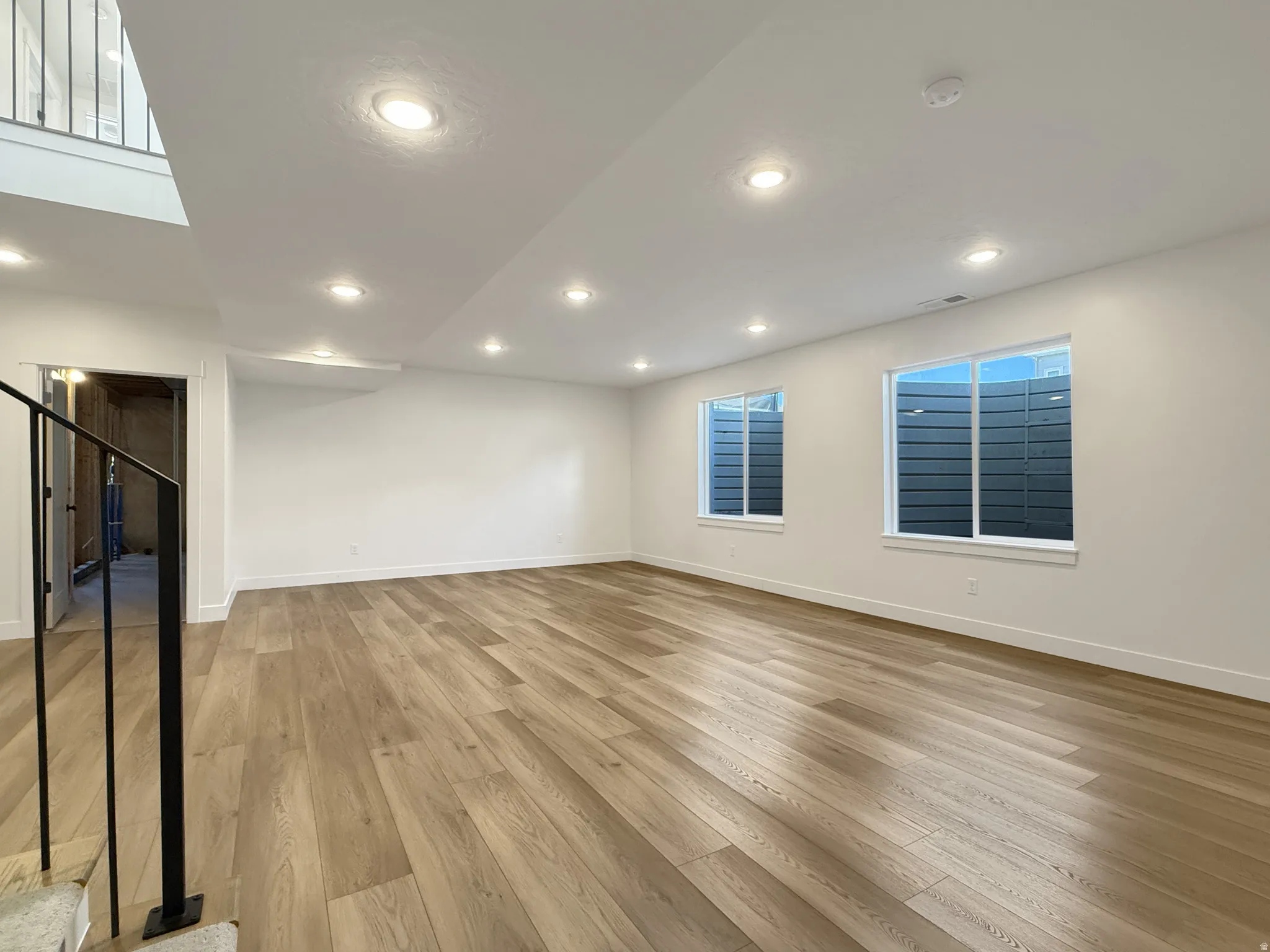 Unfurnished room with light wood-style flooring and recessed lighting