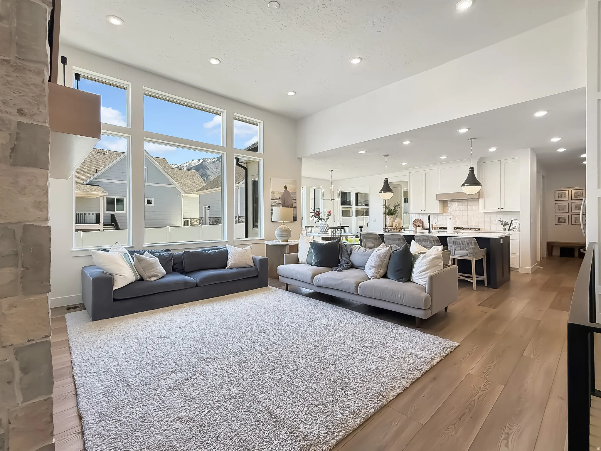 Living room with recessed lighting and light wood finished floors