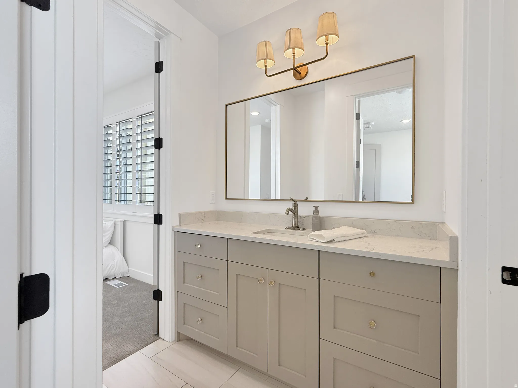 Bathroom with connected bathroom and vanity