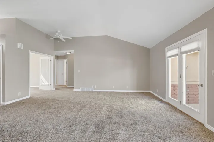 Open concept living room with lofted ceiling