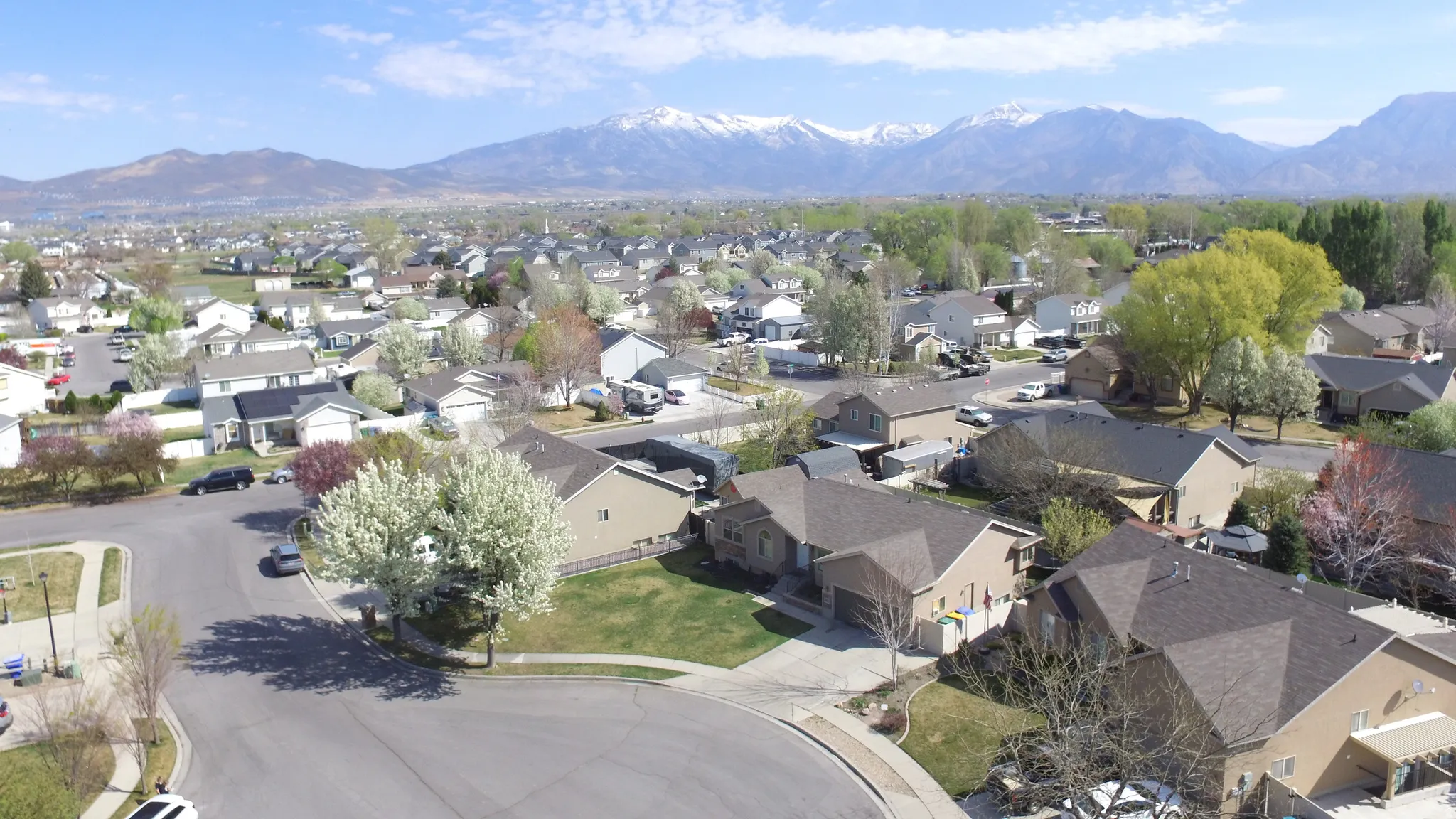 Aerial perspective of suburban area featuring a mountainous background