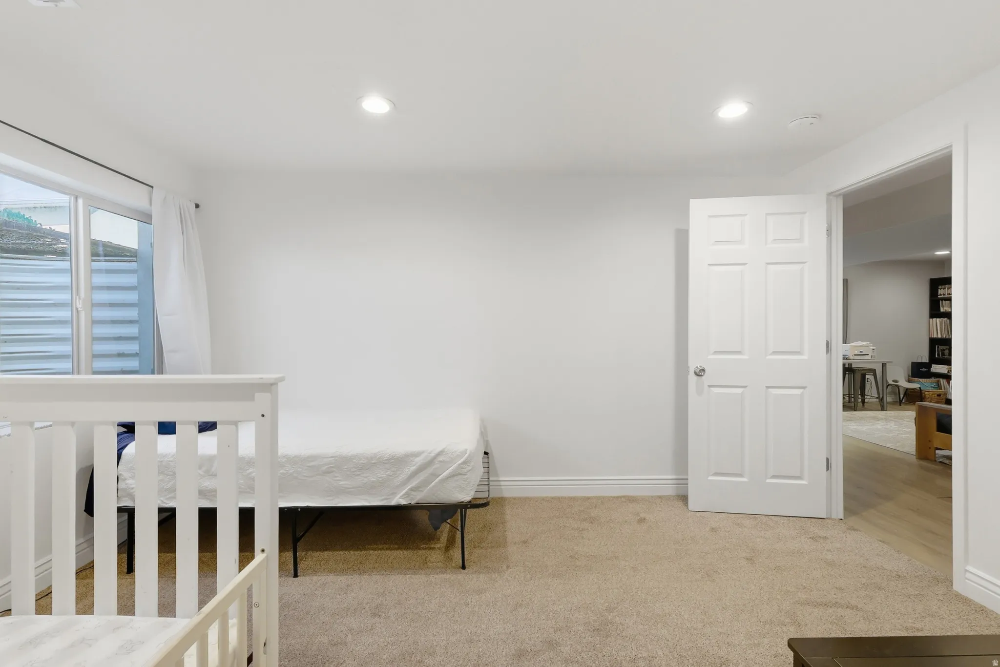 Unfurnished bedroom featuring light colored carpet and recessed lighting