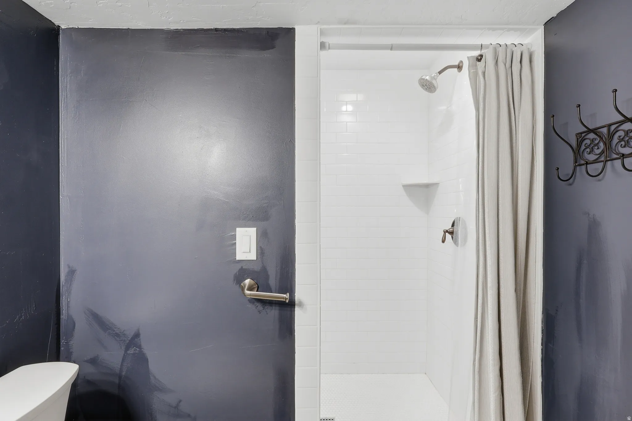 Bathroom #3 on the lower level featuring an extra-large tiled shower